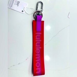Lululemon never lost keychain NWT berry: magenta